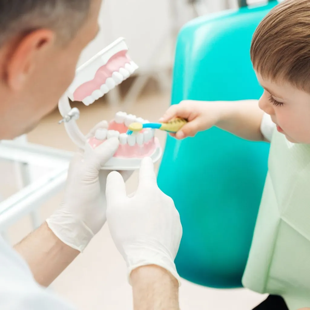 doctors showing kid how to brush teeth doctors showing kid how to brush teeth