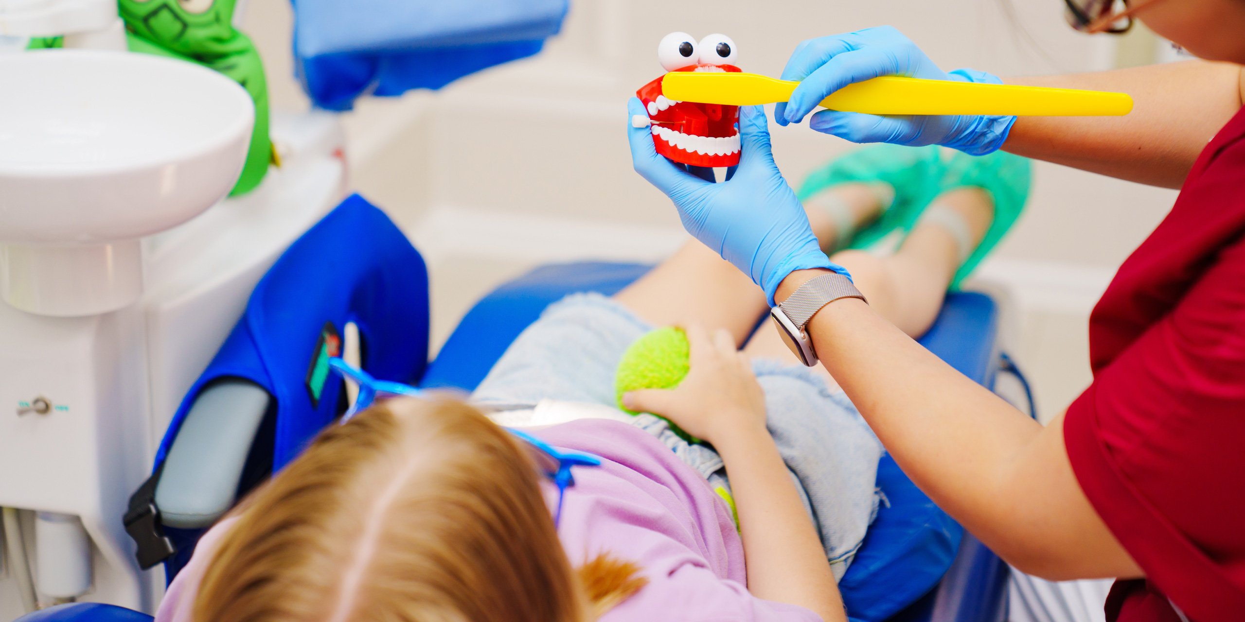 pediatric dentist with a patient