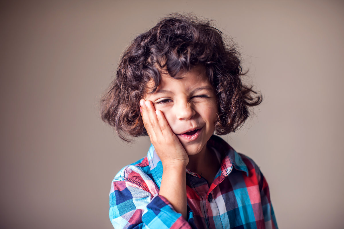 Child toothache. Closeup portrait boy with sensitive tooth ache. Negative human emotion, medicine, healthcare concept